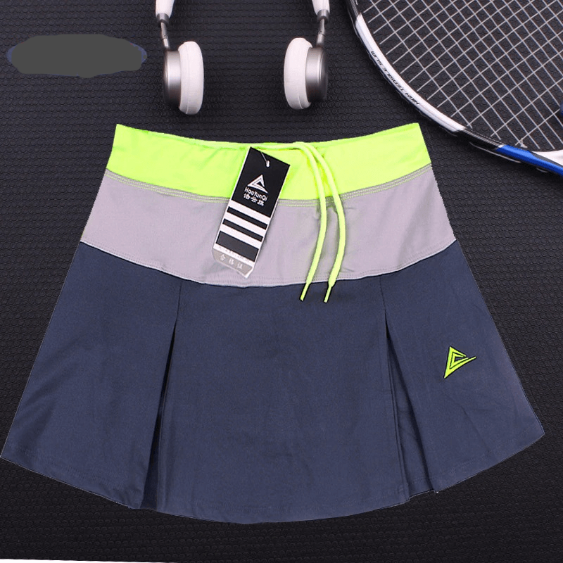 Women's breathable tennis skirt-shorts with pocket in navy blue and neon accents, perfect for sports and fitness activities.
